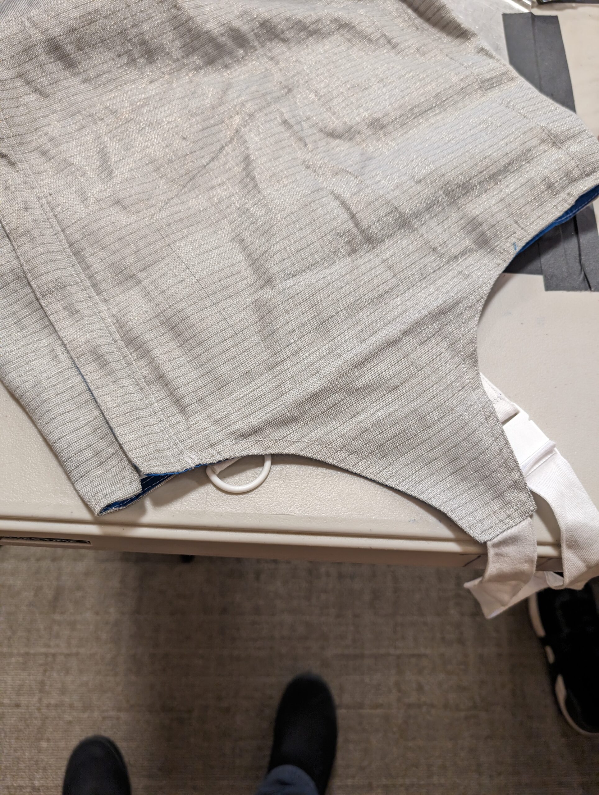 Example of an illegal bikini cut on a foil lame